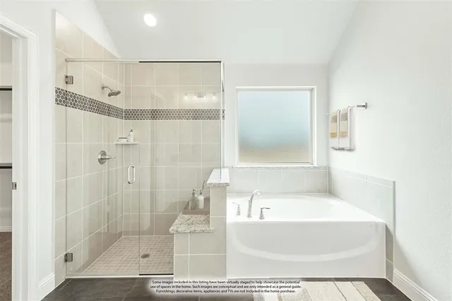 a bathroom with a tub shower and sink