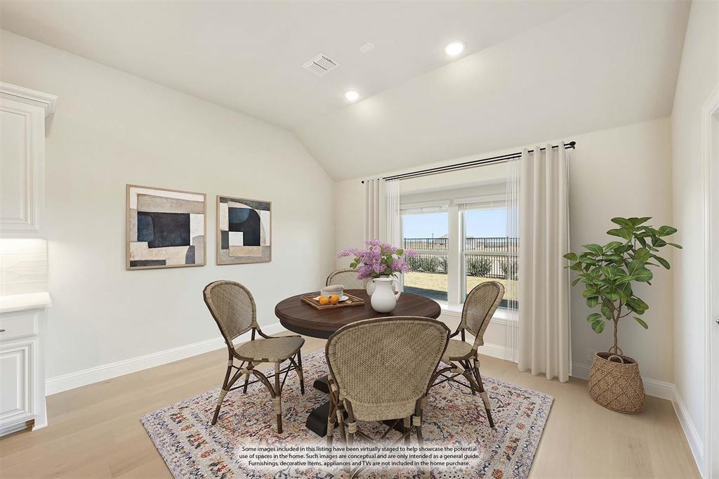 1024 Silver Sage Drive Justin, TX 76247 - Photo 20 of 35 a living room with furniture and a potted plant