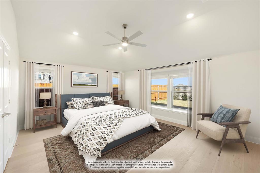 1024 Silver Sage Drive Justin, TX 76247 - Photo 23 of 35 a bedroom with a large bed couch and a window