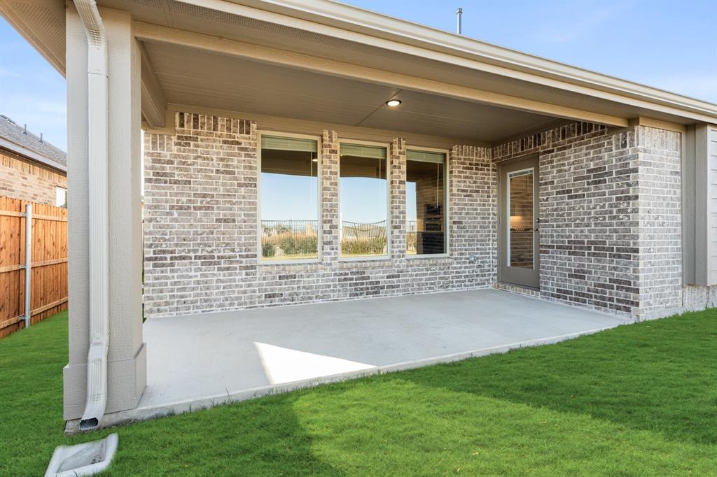 1024 Silver Sage Drive Justin, TX 76247 - Photo 32 of 35 a view of house with backyard