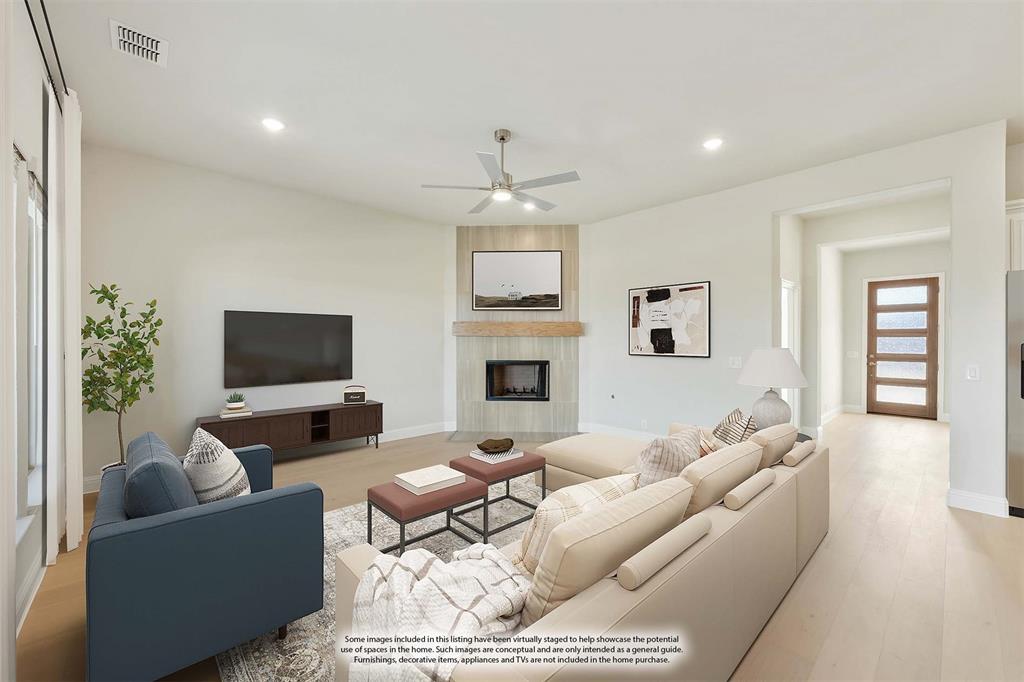 1024 Silver Sage Drive Justin, TX 76247 - Photo 10 of 35 a living room with furniture a fireplace and a flat screen tv