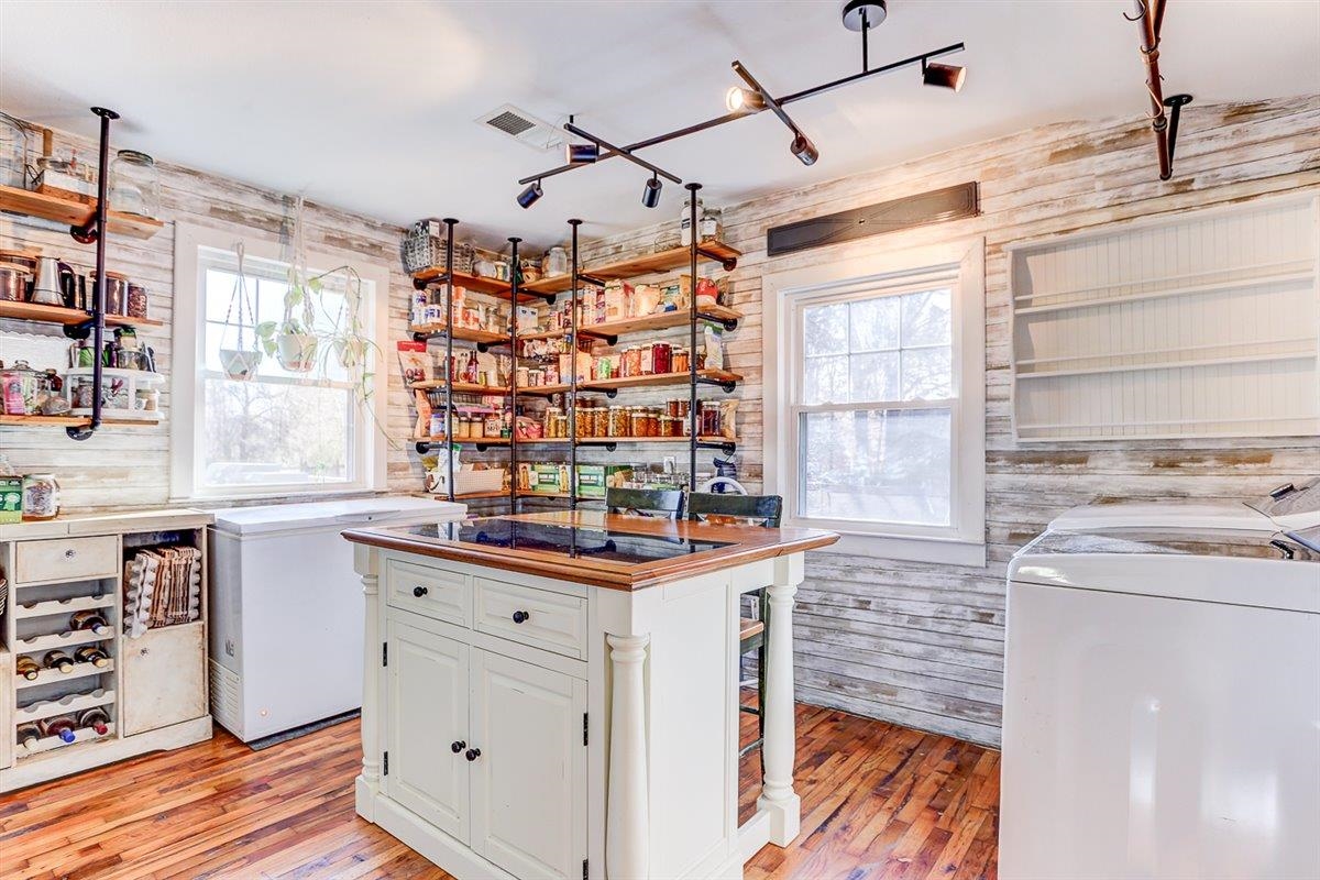 a kitchen with stainless steel appliances a stove and a refrigerator