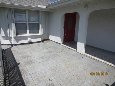 2155 Southeast Rainier Road Port St. Lucie, FL 34952 - Photo 3 of 20 Front patio
