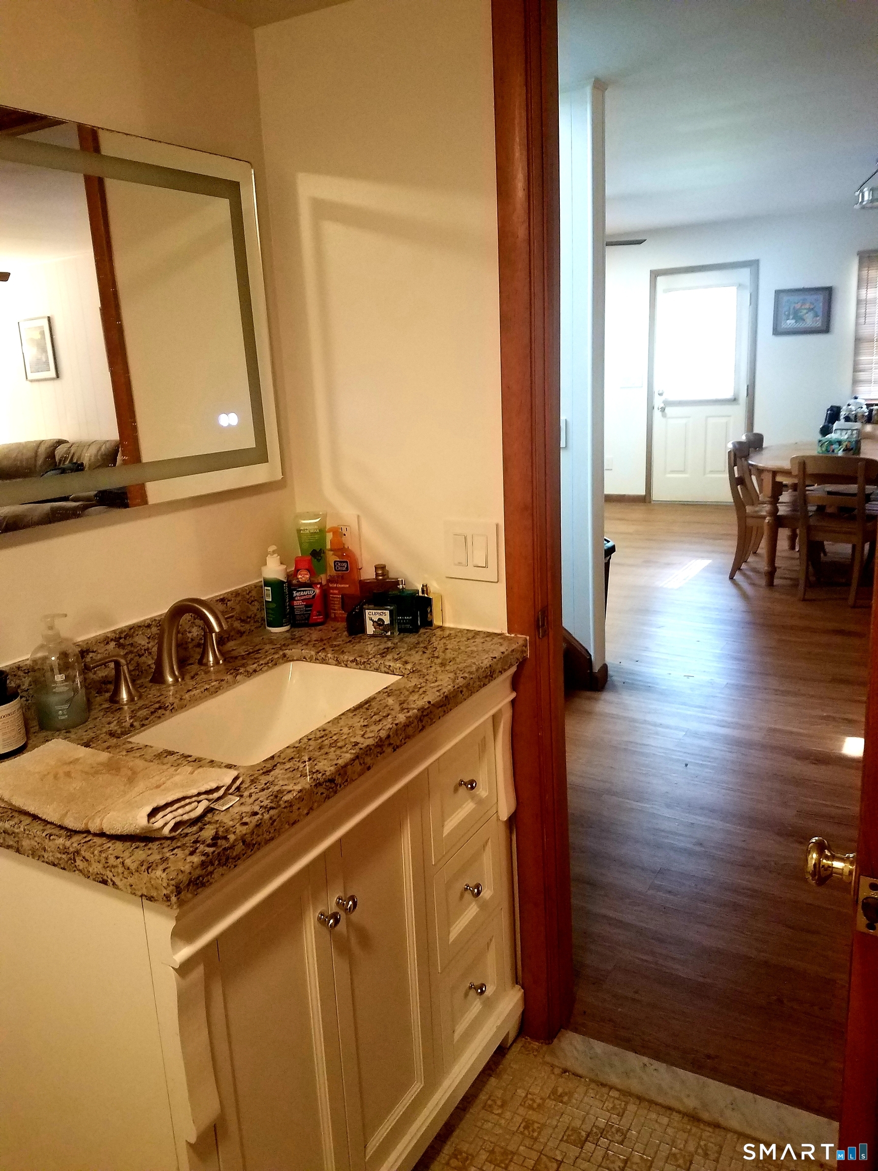72 Maple Tree Avenue, Unit 2 Stamford, CT 06906 - Photo 7 of 25 a bathroom with a sink and a mirror