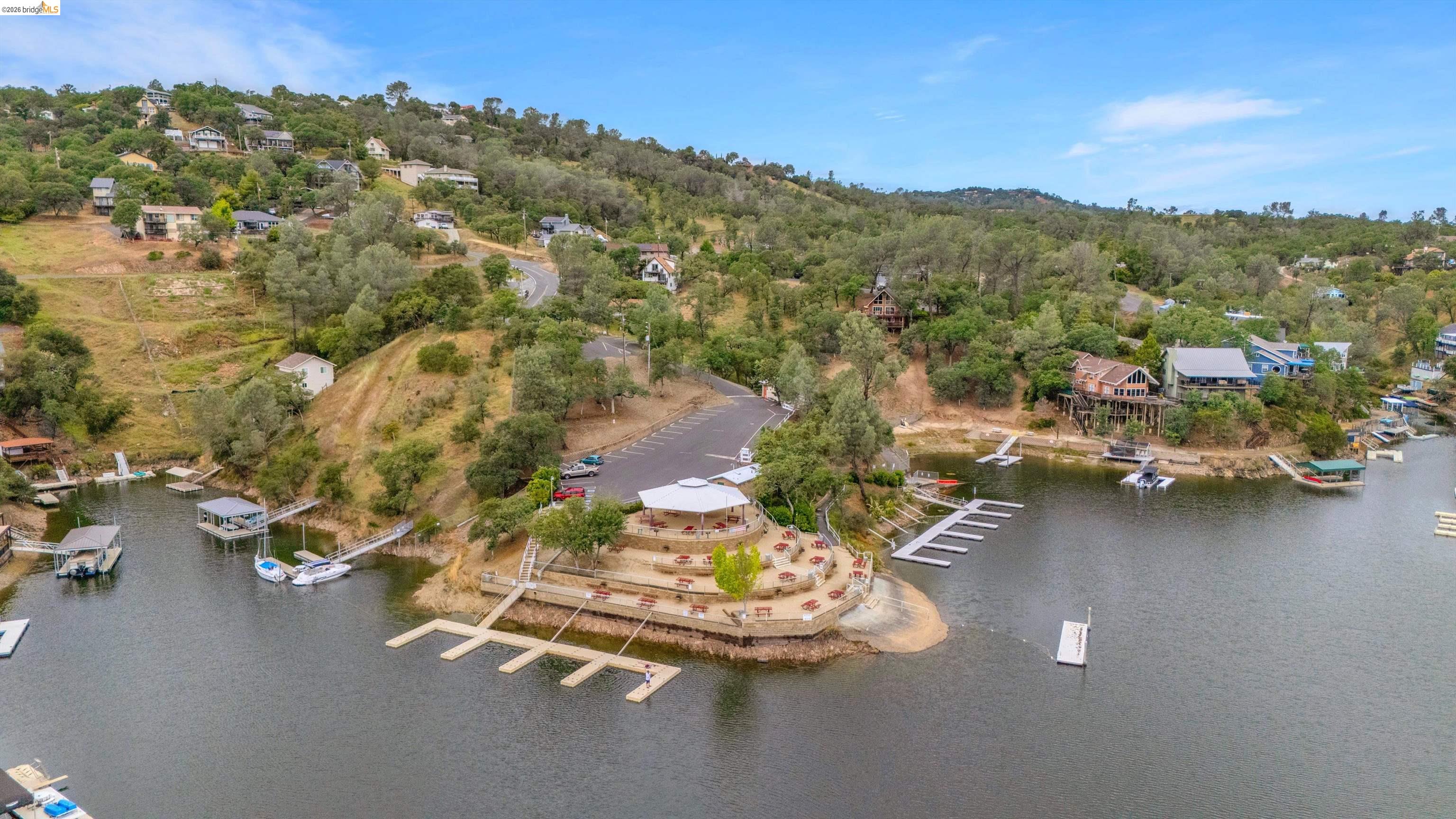 4459 Council Trail Copperopolis, CA 95228 - Photo 12 of 16 an aerial view of a house with a yard and lake view