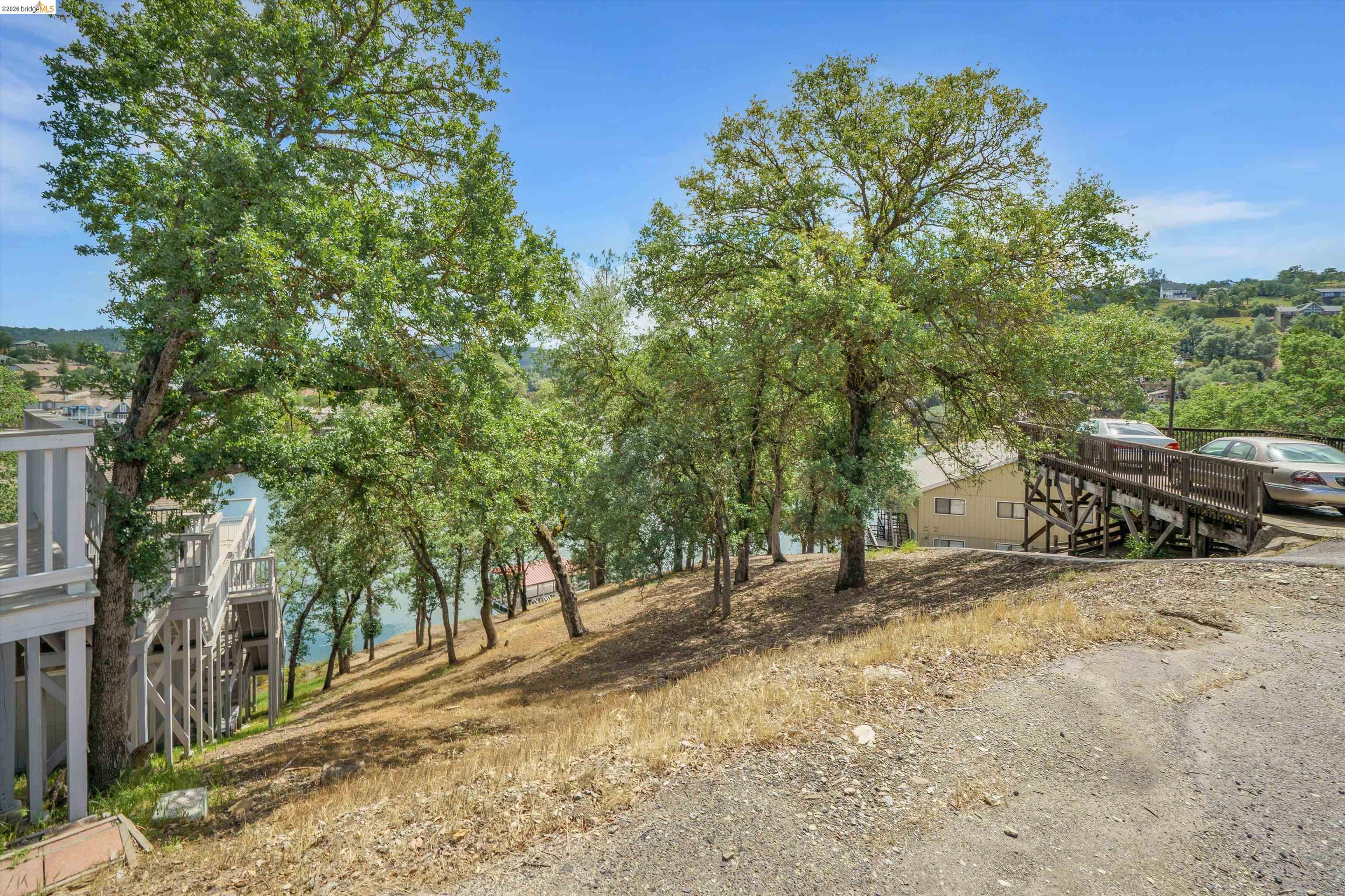 4459 Council Trail Copperopolis, CA 95228 - Photo 6 of 16 a view of outdoor space with deck and trees