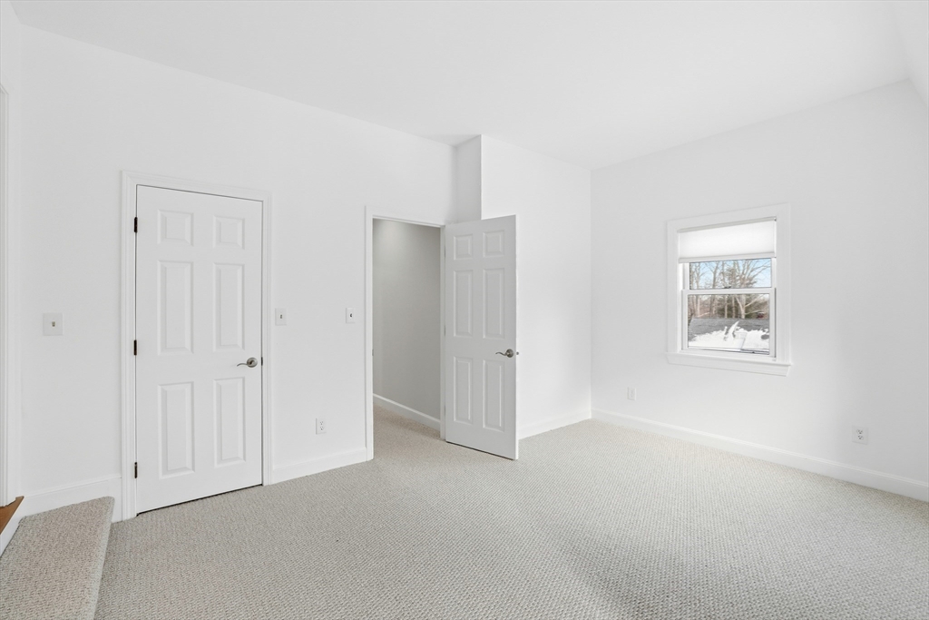 74 Branch Street, Unit 15 Scituate, MA 02066 - Photo 22 of 26 an empty room with windows and closet