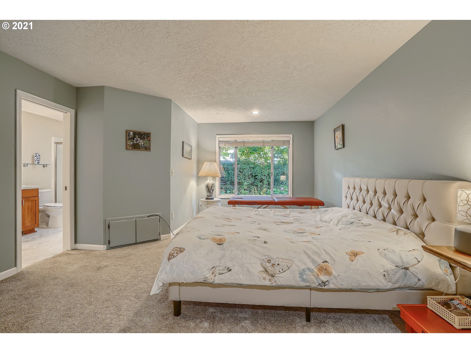 545 Southwest 167th Avenue Beaverton, OR 97006 - Photo 14 of 32 a bed sitting in a bedroom next to a window