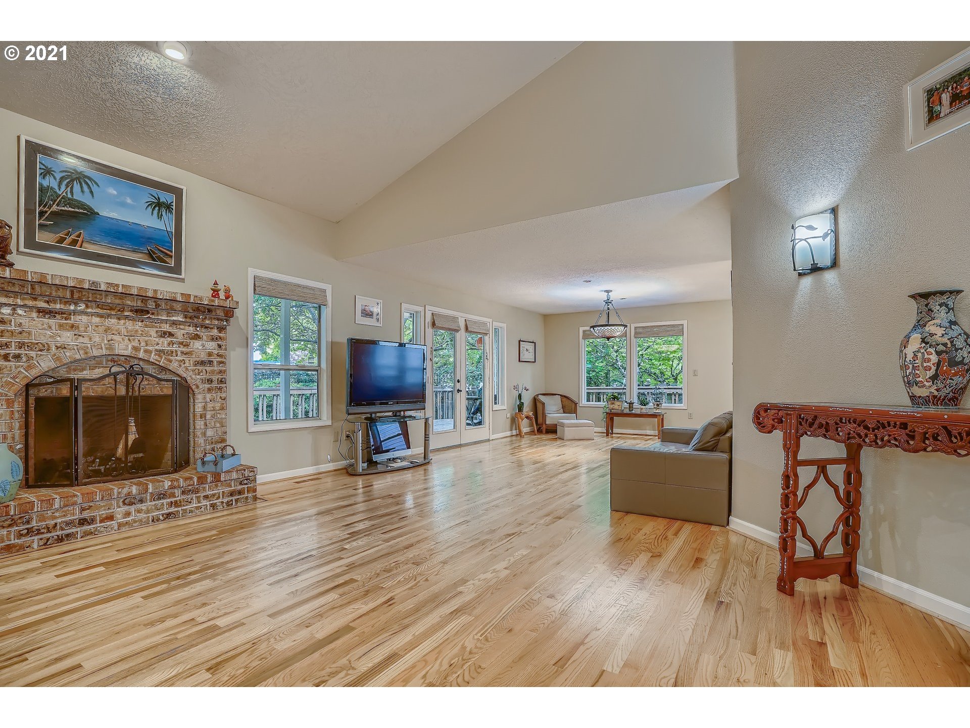 545 Southwest 167th Avenue Beaverton, OR 97006 - Photo 7 of 32 a living room with furniture and a fireplace