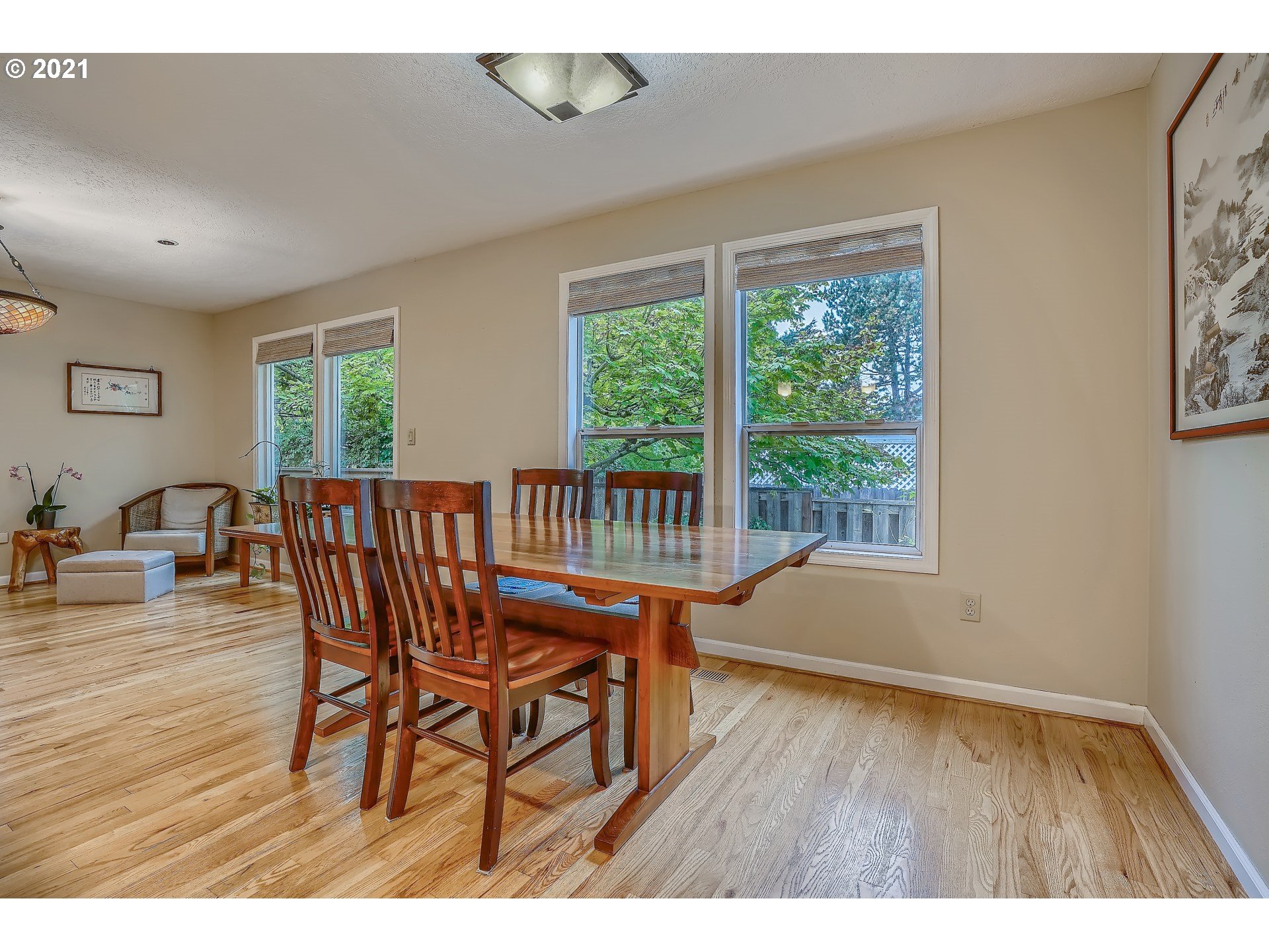 545 Southwest 167th Avenue Beaverton, OR 97006 - Photo 8 of 32 a dining room with furniture and wooden floor