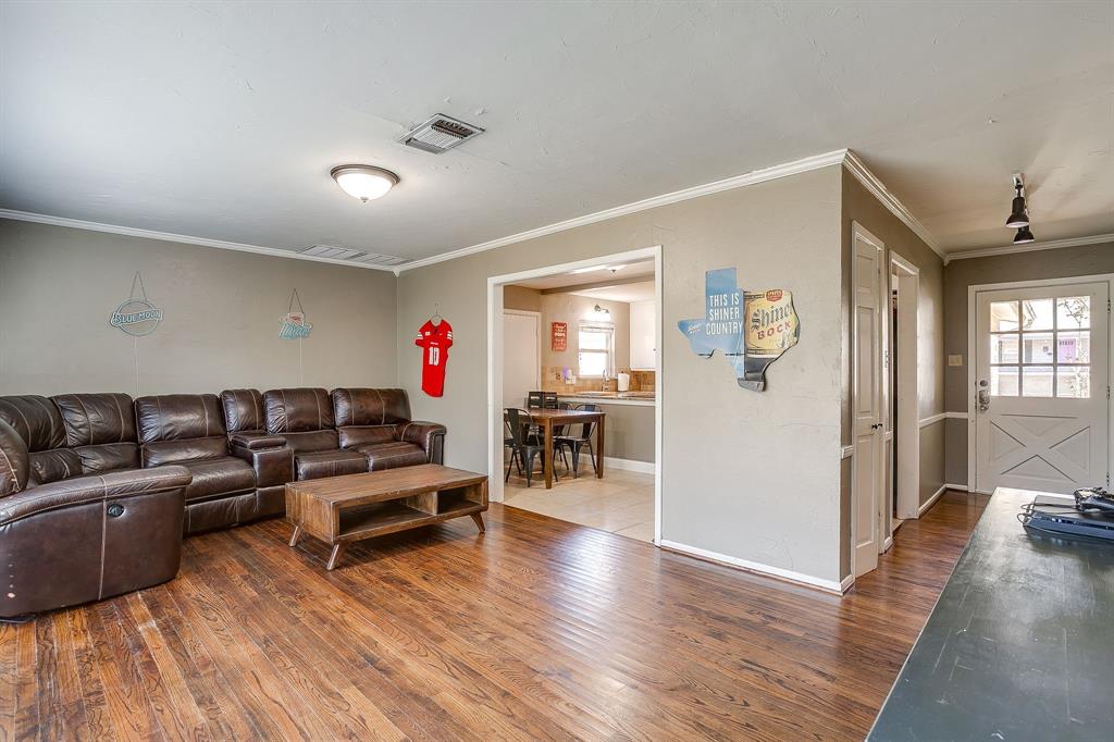 3612 Winston Road Fort Worth, TX 76109 - Photo 11 of 40 a living room with furniture and a wooden floor