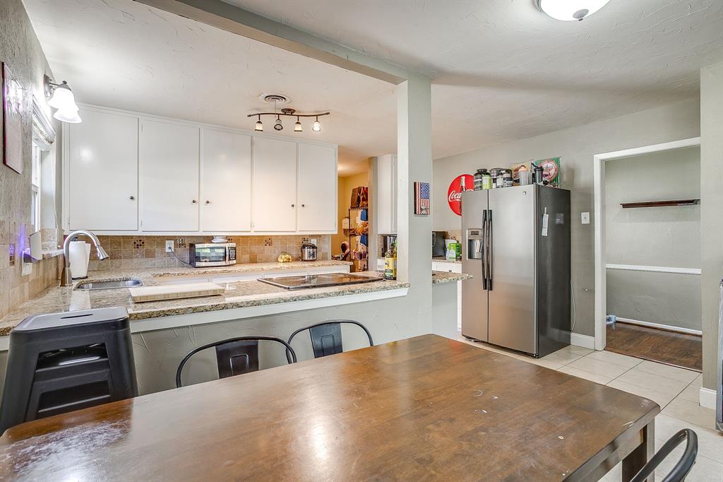 3612 Winston Road Fort Worth, TX 76109 - Photo 14 of 40 a kitchen with a sink stove and refrigerator