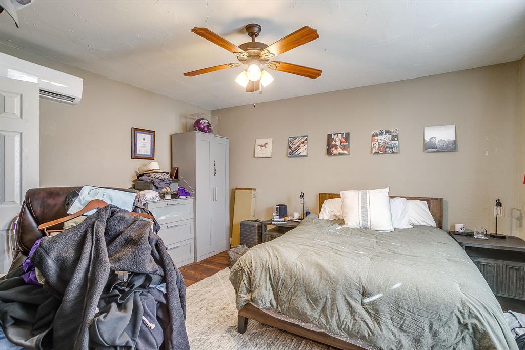 3612 Winston Road Fort Worth, TX 76109 - Photo 20 of 40 a bedroom with a bed and a ceiling fan