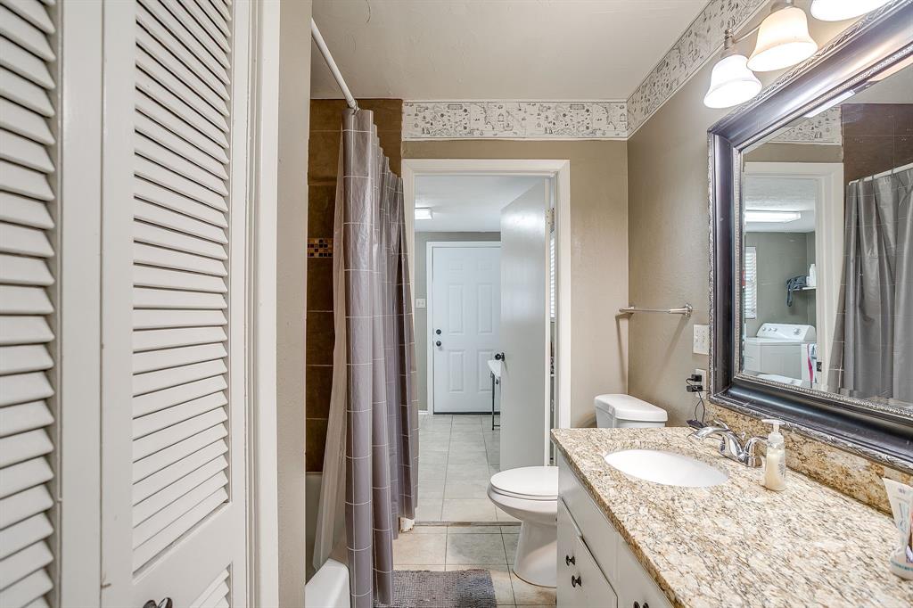 3612 Winston Road Fort Worth, TX 76109 - Photo 24 of 40 a bathroom with a granite countertop sink and a mirror