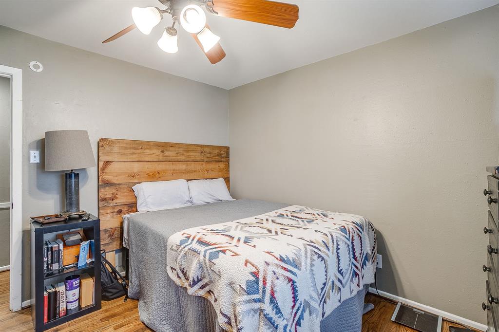 3612 Winston Road Fort Worth, TX 76109 - Photo 26 of 40 a bedroom with a bed and a chandelier