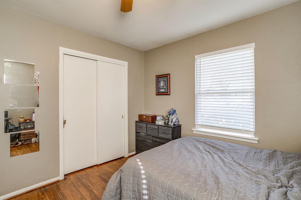 3612 Winston Road Fort Worth, TX 76109 - Photo 32 of 40 a bedroom with a bed and wooden floor