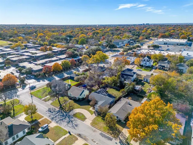 an aerial view of residential houses with outdoor space