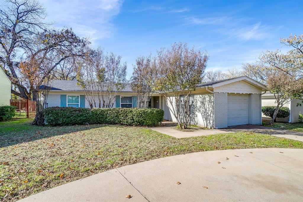 3612 Winston Road Fort Worth, TX 76109 - Photo 4 of 40 a front view of a house with a yard and garage