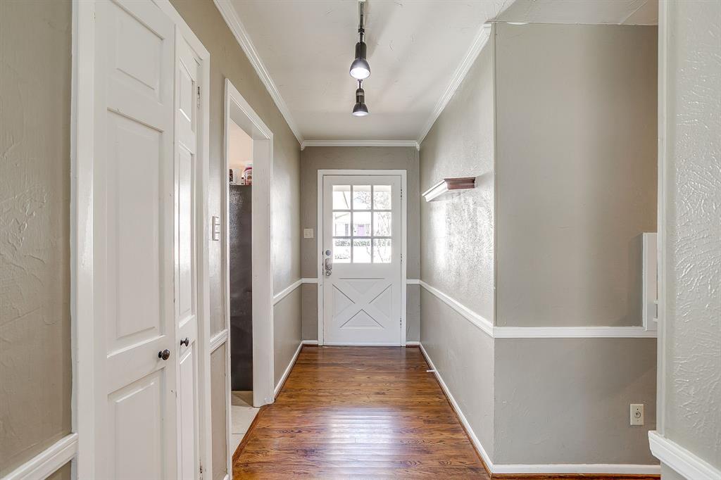 3612 Winston Road Fort Worth, TX 76109 - Photo 7 of 40 a view of a hallway with wooden floor and staircase