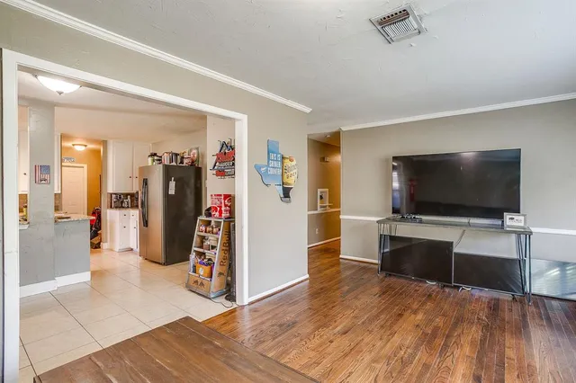a view of a livingroom with furniture and a flat screen tv