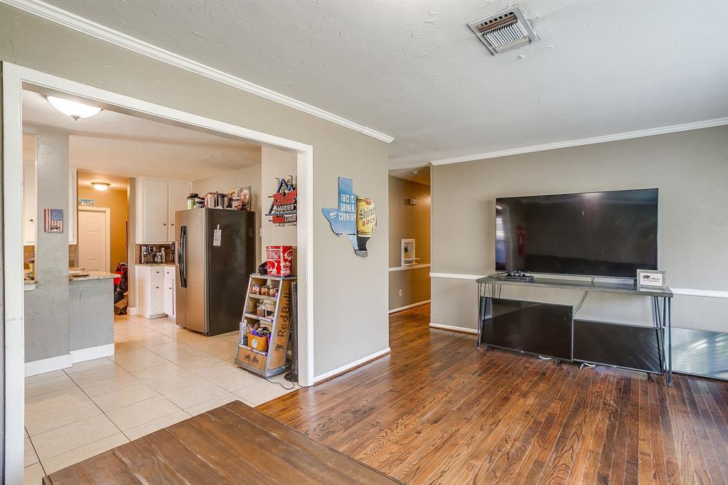 3612 Winston Road Fort Worth, TX 76109 - Photo 10 of 40 a view of a livingroom with furniture and a flat screen tv