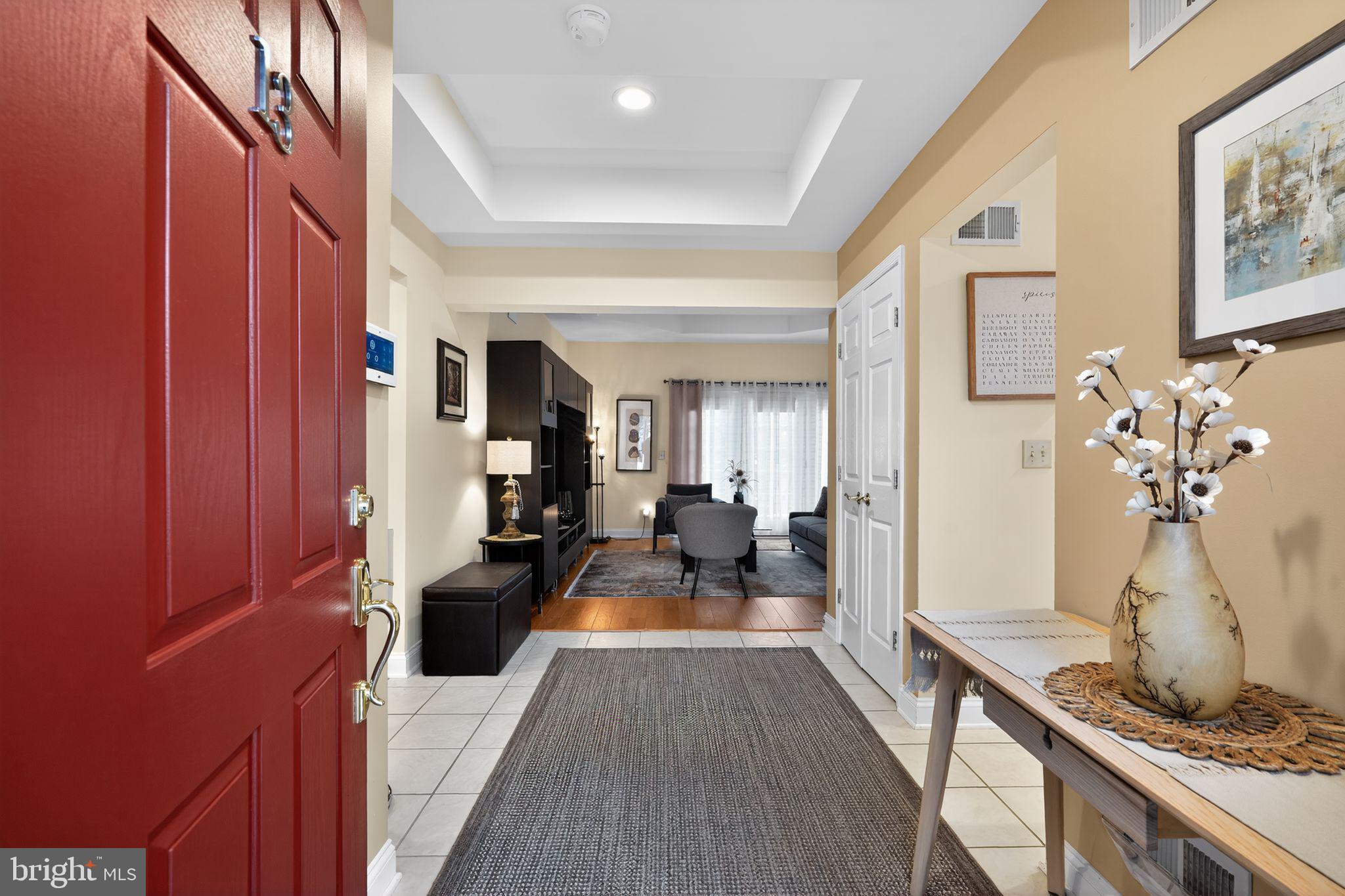 13 Hedge Row Road Princeton, NJ 08540 - Photo 14 of 41 a living room with furniture and a chandelier