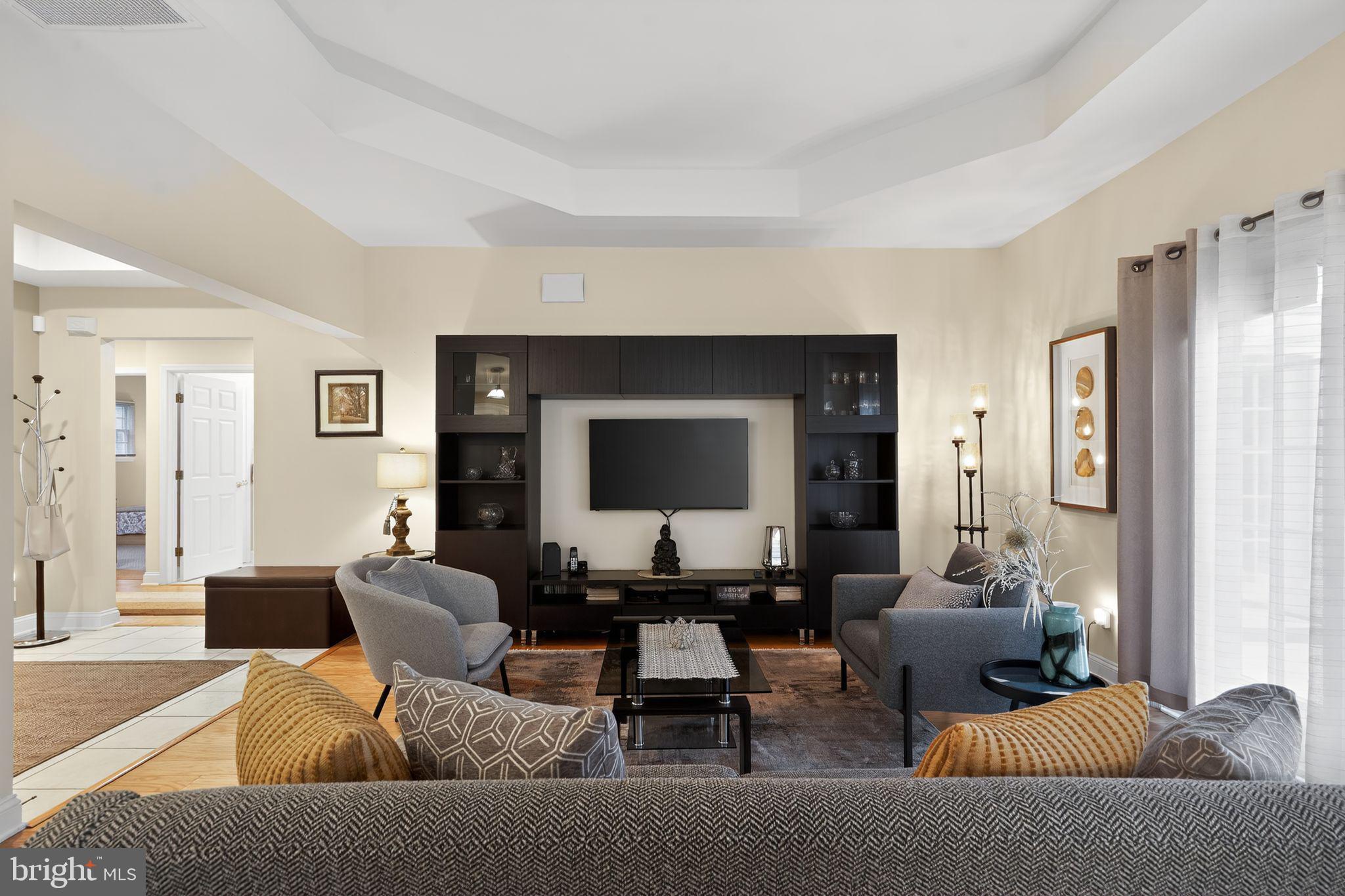 13 Hedge Row Road Princeton, NJ 08540 - Photo 17 of 41 a living room with furniture and a flat screen tv