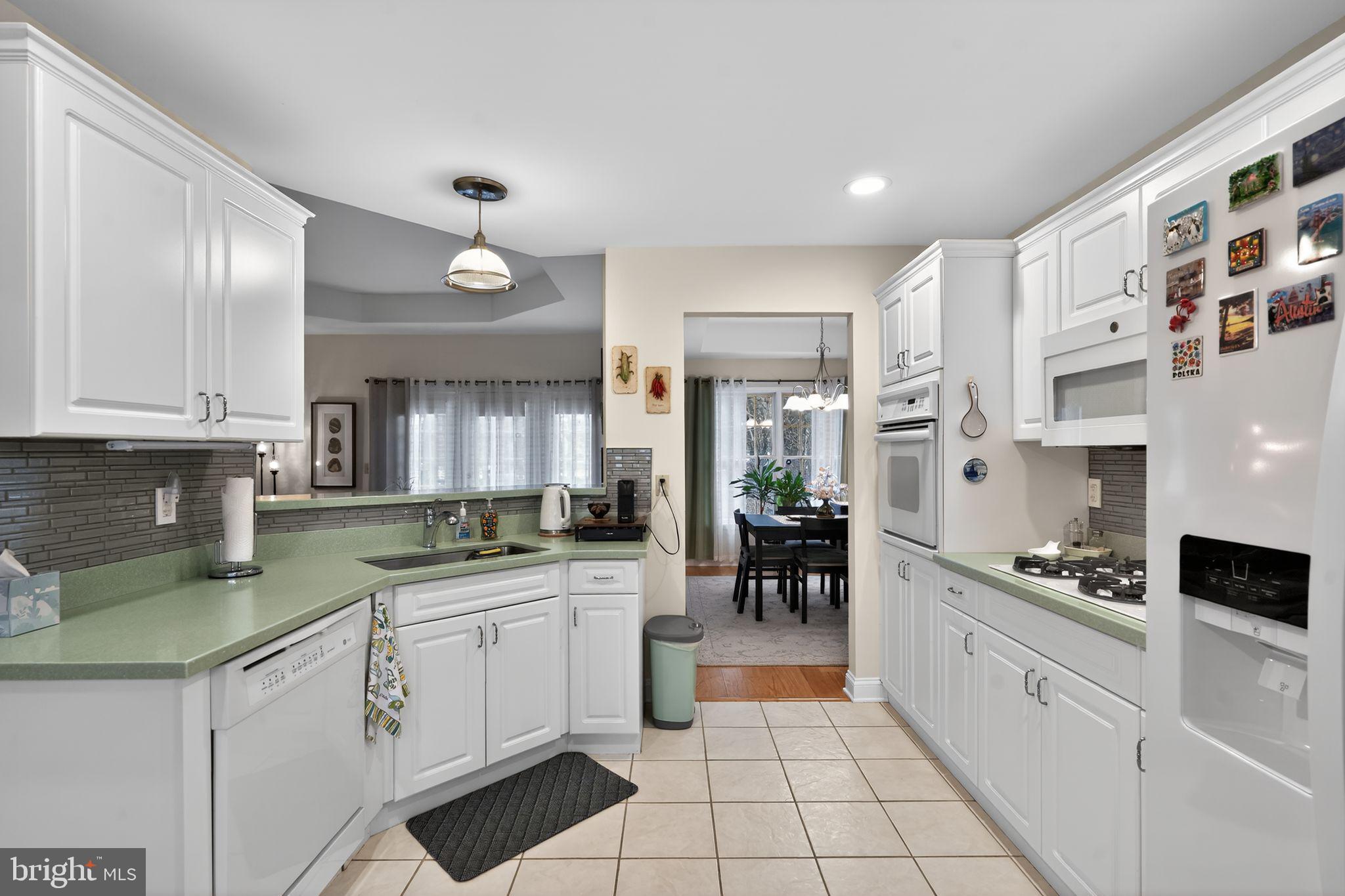 13 Hedge Row Road Princeton, NJ 08540 - Photo 22 of 41 a kitchen with stainless steel appliances kitchen island granite countertop a sink and cabinets