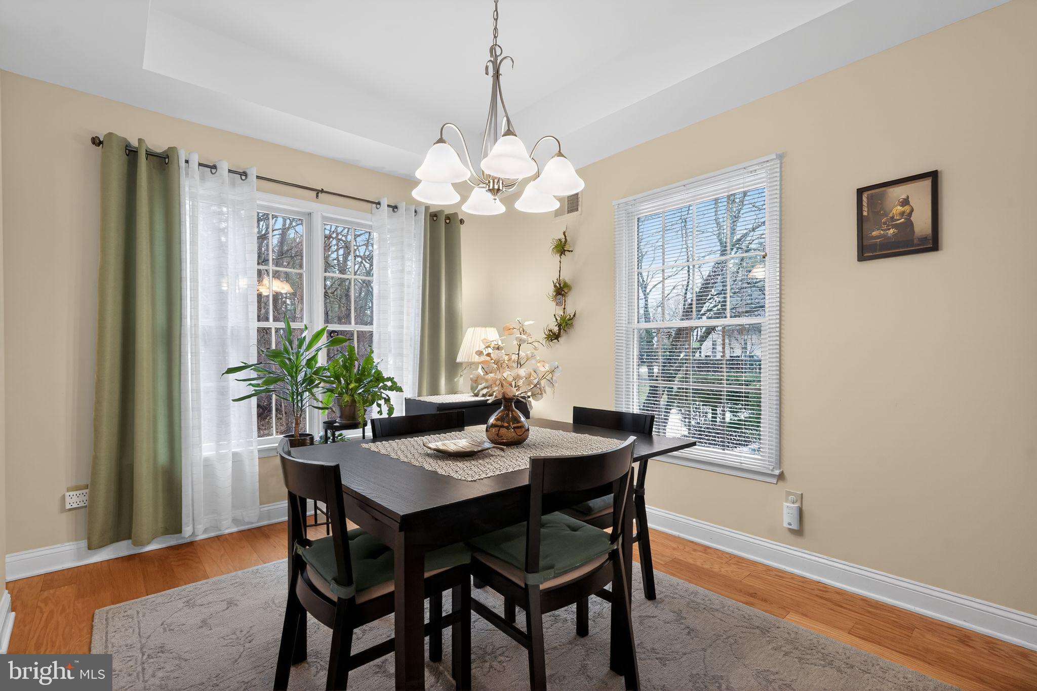 13 Hedge Row Road Princeton, NJ 08540 - Photo 29 of 41 a dining room with furniture potted plants and wooden floor