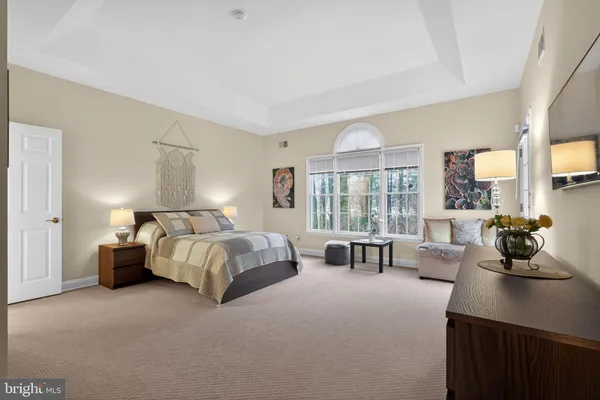 a bed room with a bed and a chair