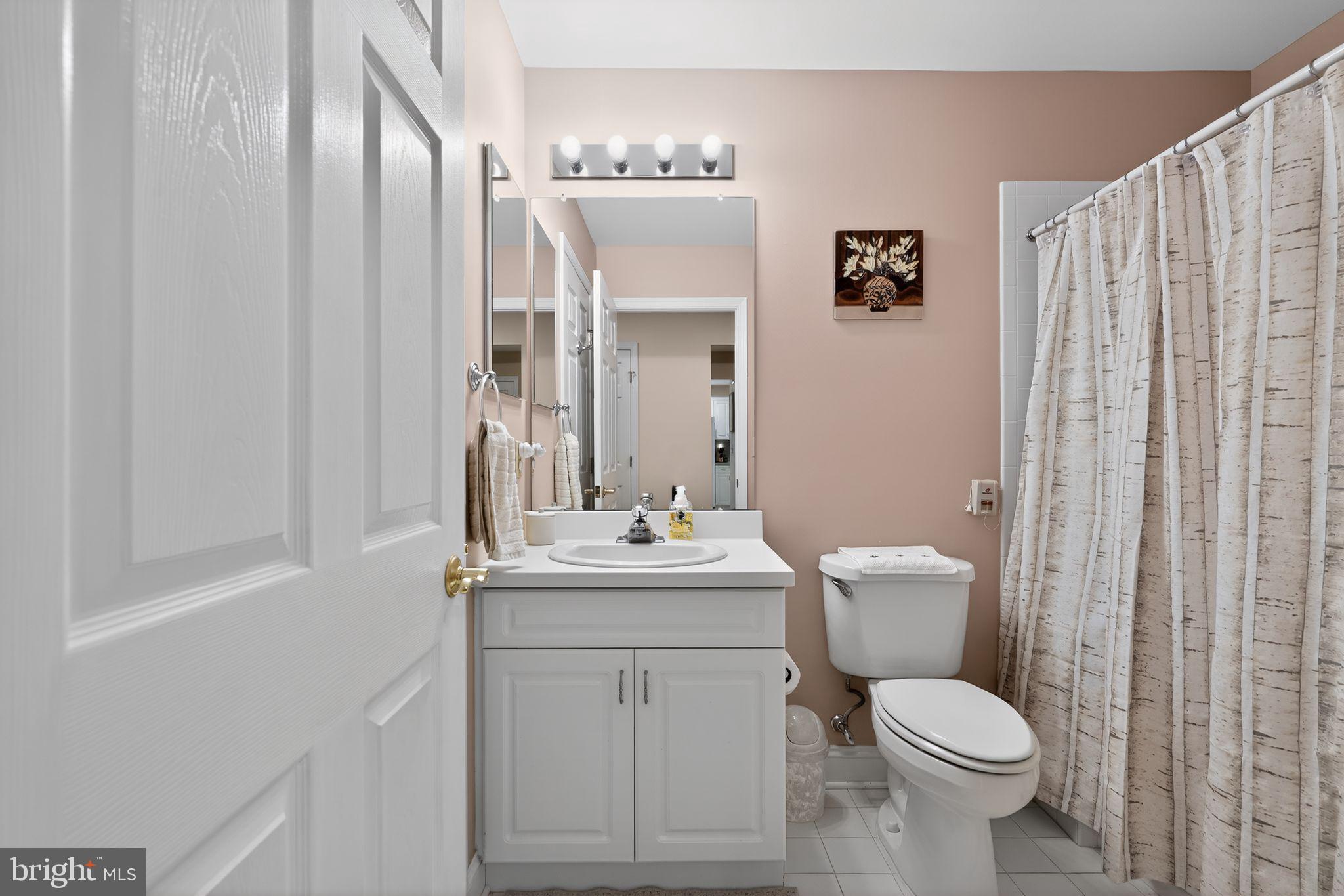 13 Hedge Row Road Princeton, NJ 08540 - Photo 35 of 41 a bathroom with a toilet a sink and mirror