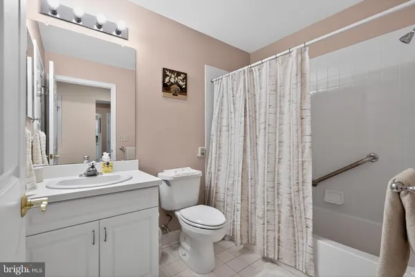 a spacious bathroom with a double vanity sink mirror and