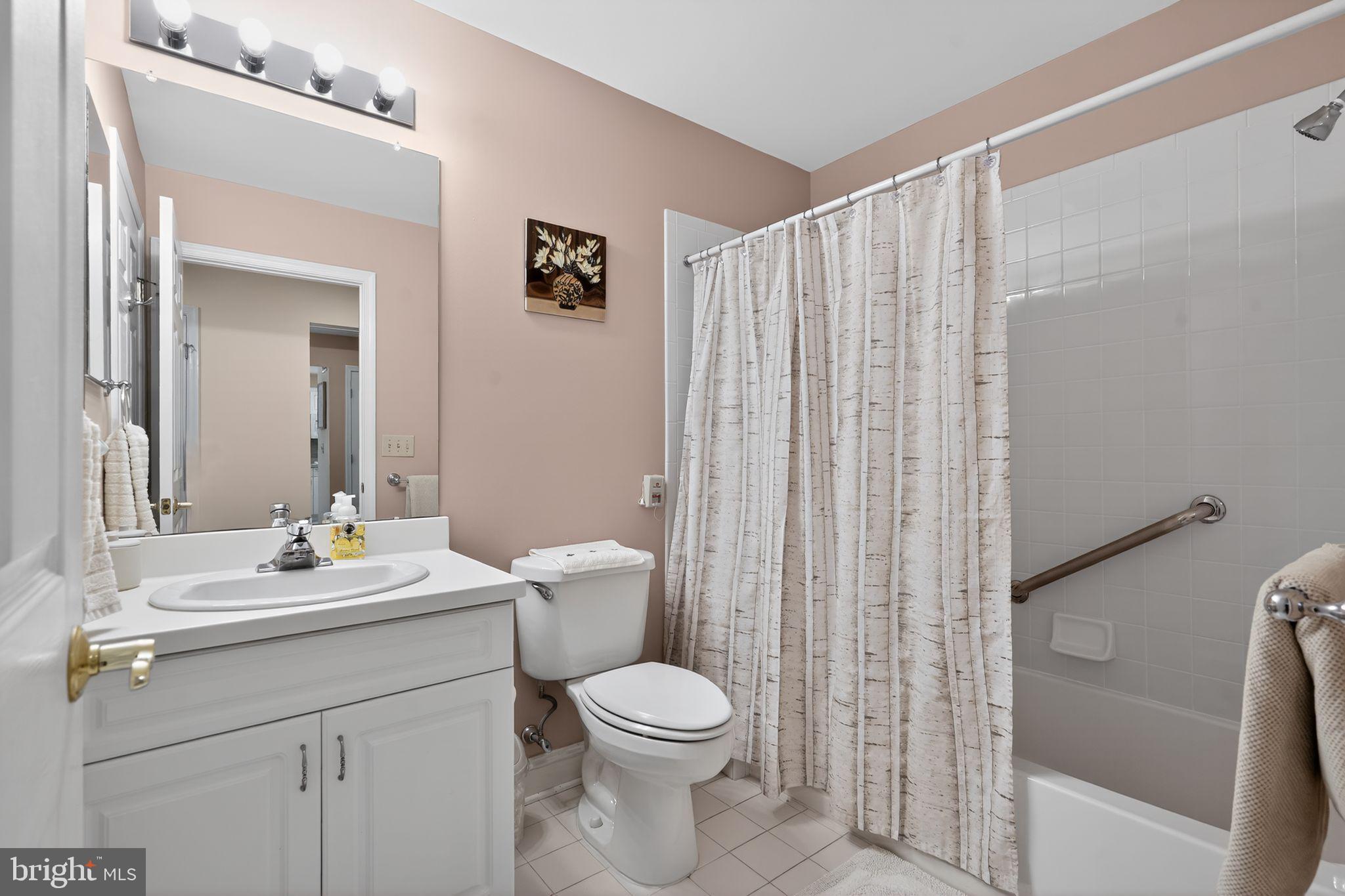 13 Hedge Row Road Princeton, NJ 08540 - Photo 36 of 41 a bathroom with a sink vanity mirror and toilet