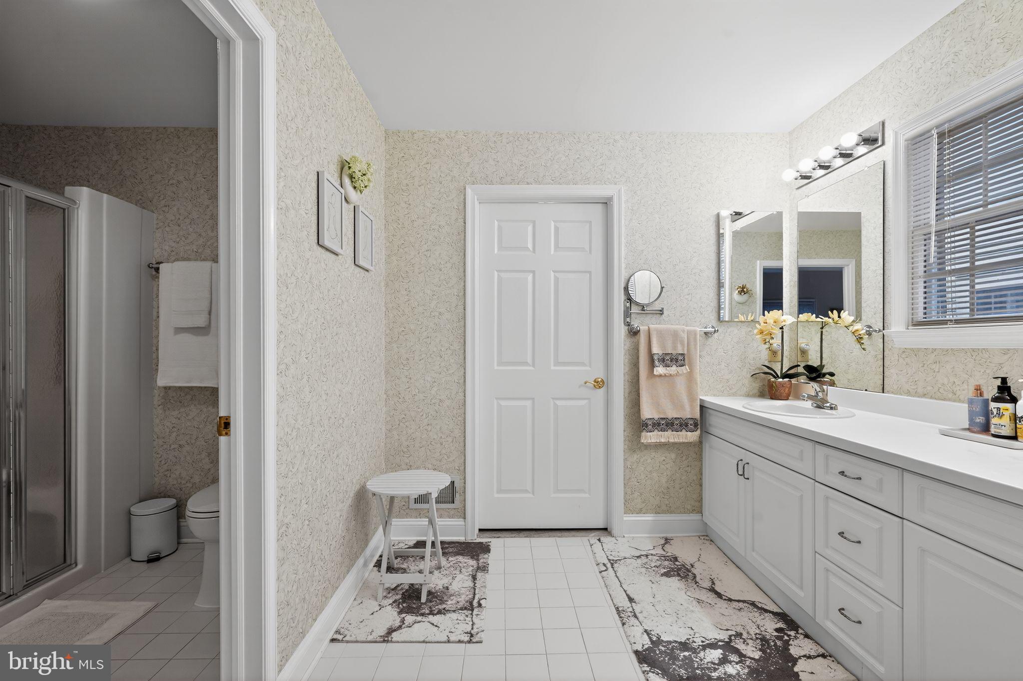 13 Hedge Row Road Princeton, NJ 08540 - Photo 39 of 41 a spacious bathroom with a double vanity sink a mirror and a toilet