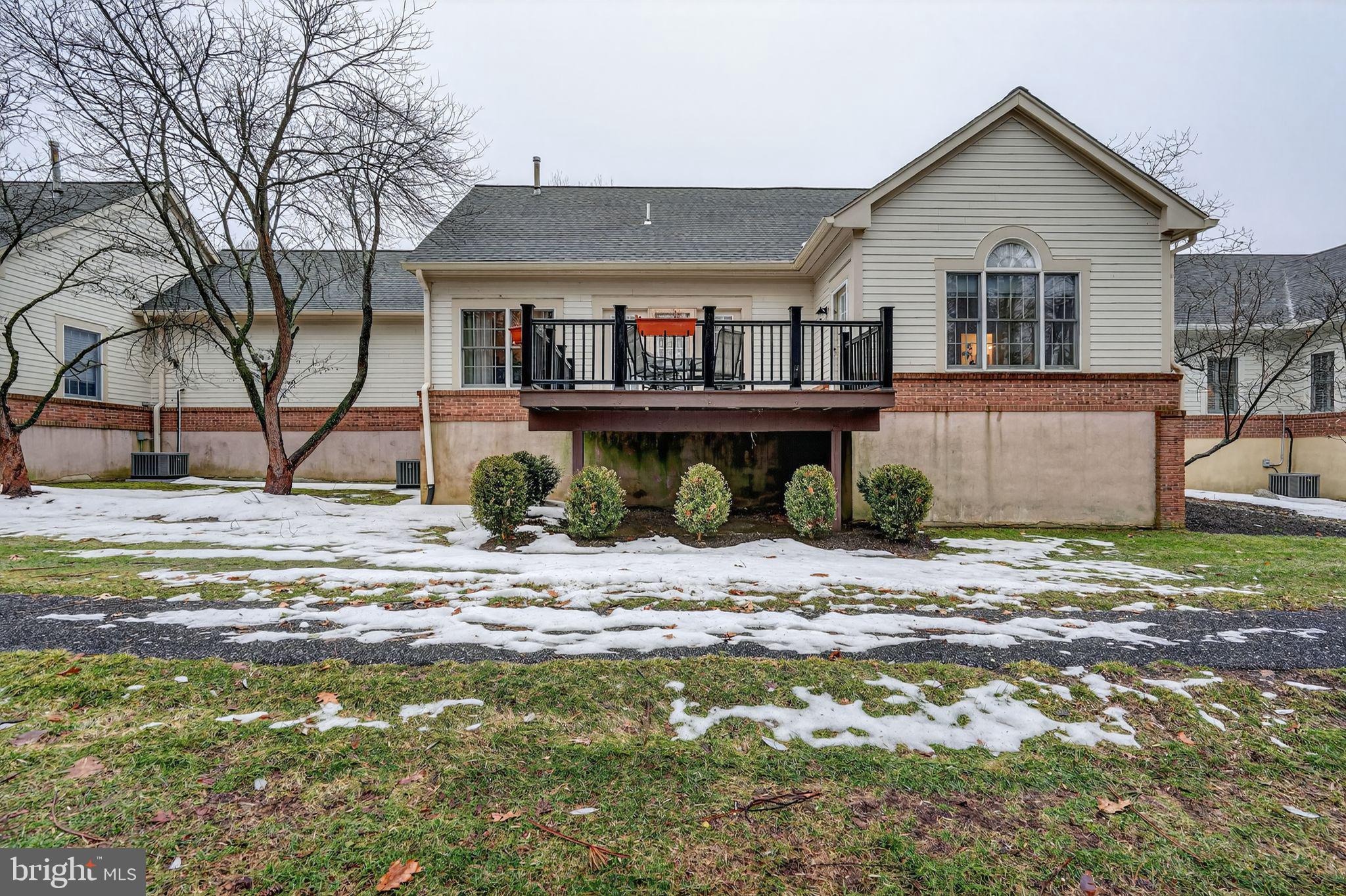 13 Hedge Row Road Princeton, NJ 08540 - Photo 5 of 41 a front view of a house with a yard and glass window