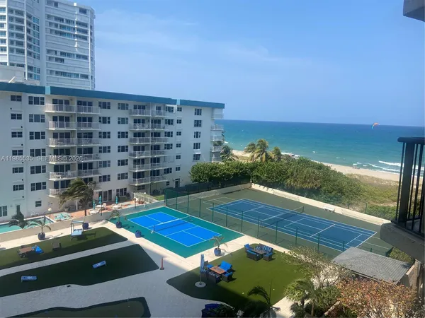 a view of swimming pool with outdoor seating and yard
