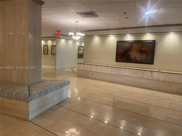 a view of lobby with a hallway