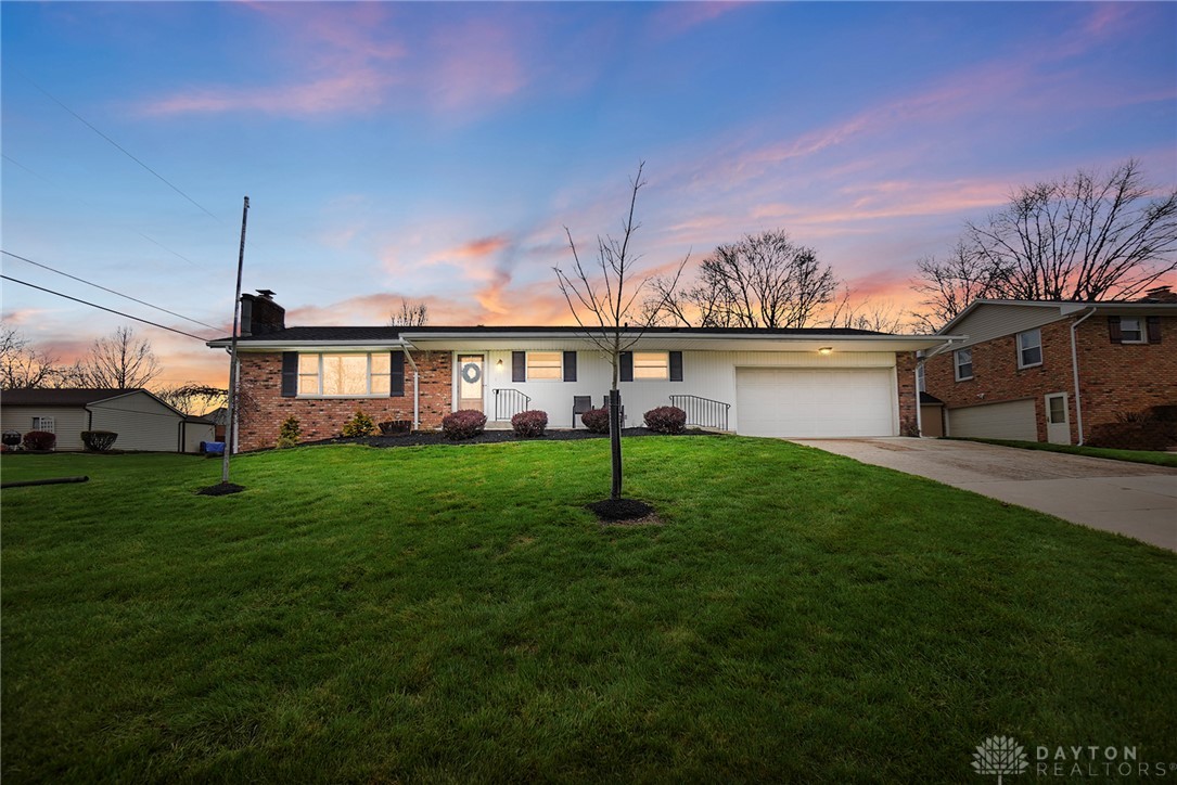 1628 Yorkshire Court Springfield, OH 45503 - Photo 1 of 47 This charming residence offers a welcoming facade with a well-maintained lawn under a vibrant sky.