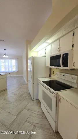 a view of a double sink and a mirror