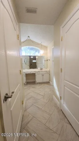 a view of a sink storage and utility room