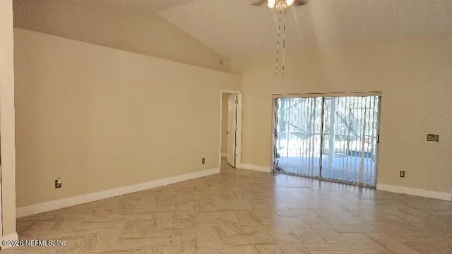 a view of an empty room with a window