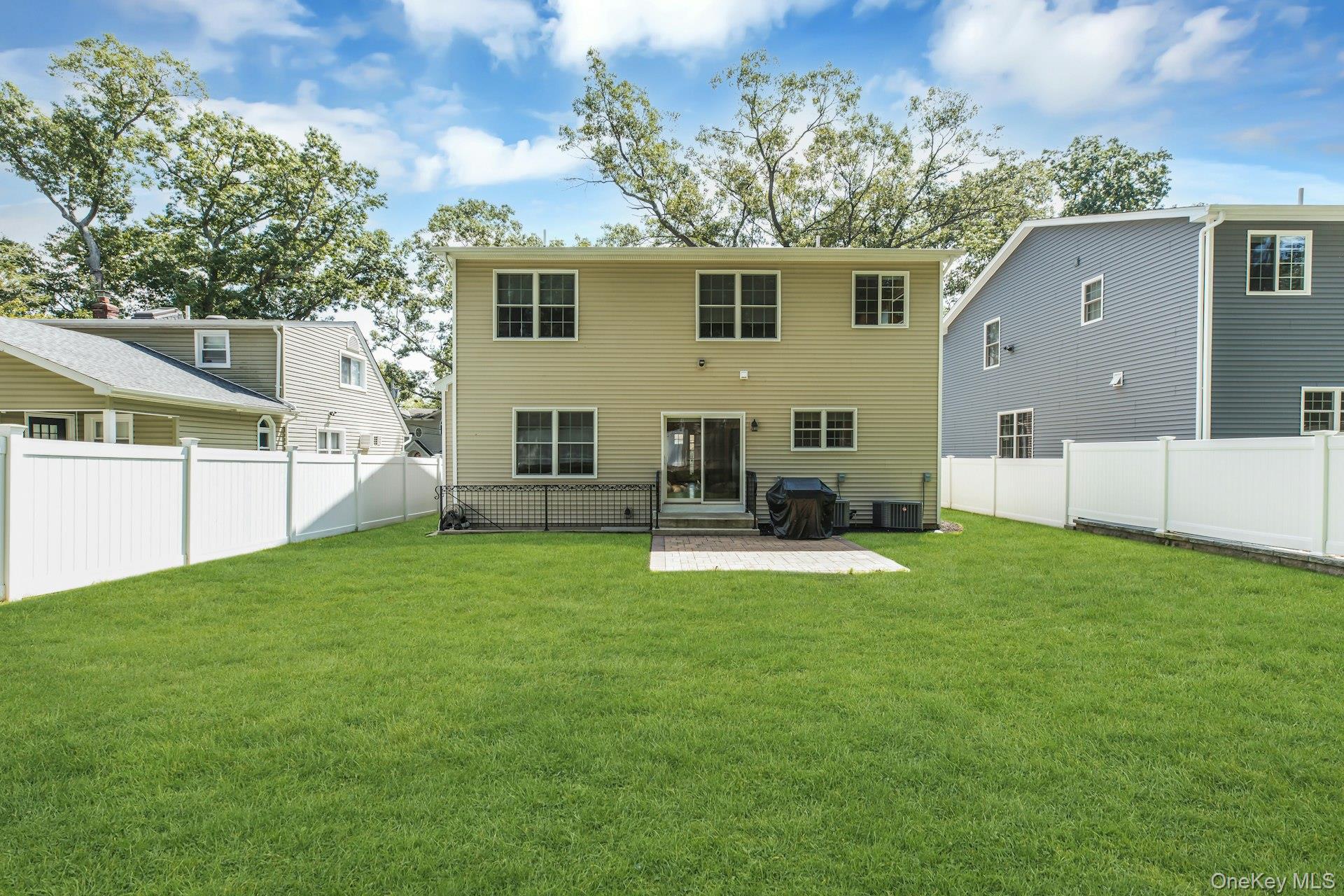 9 Hickory Road Bayville, NY 11709 - Photo 20 of 30 Rear yard with patio for alfresco dining.