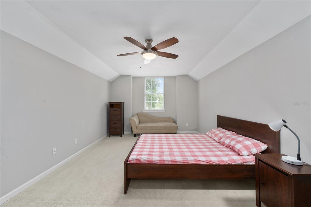8942 Southwest 25 Road Gainesville, FL 32608 - Photo 16 of 22 a bedroom with a bed and window