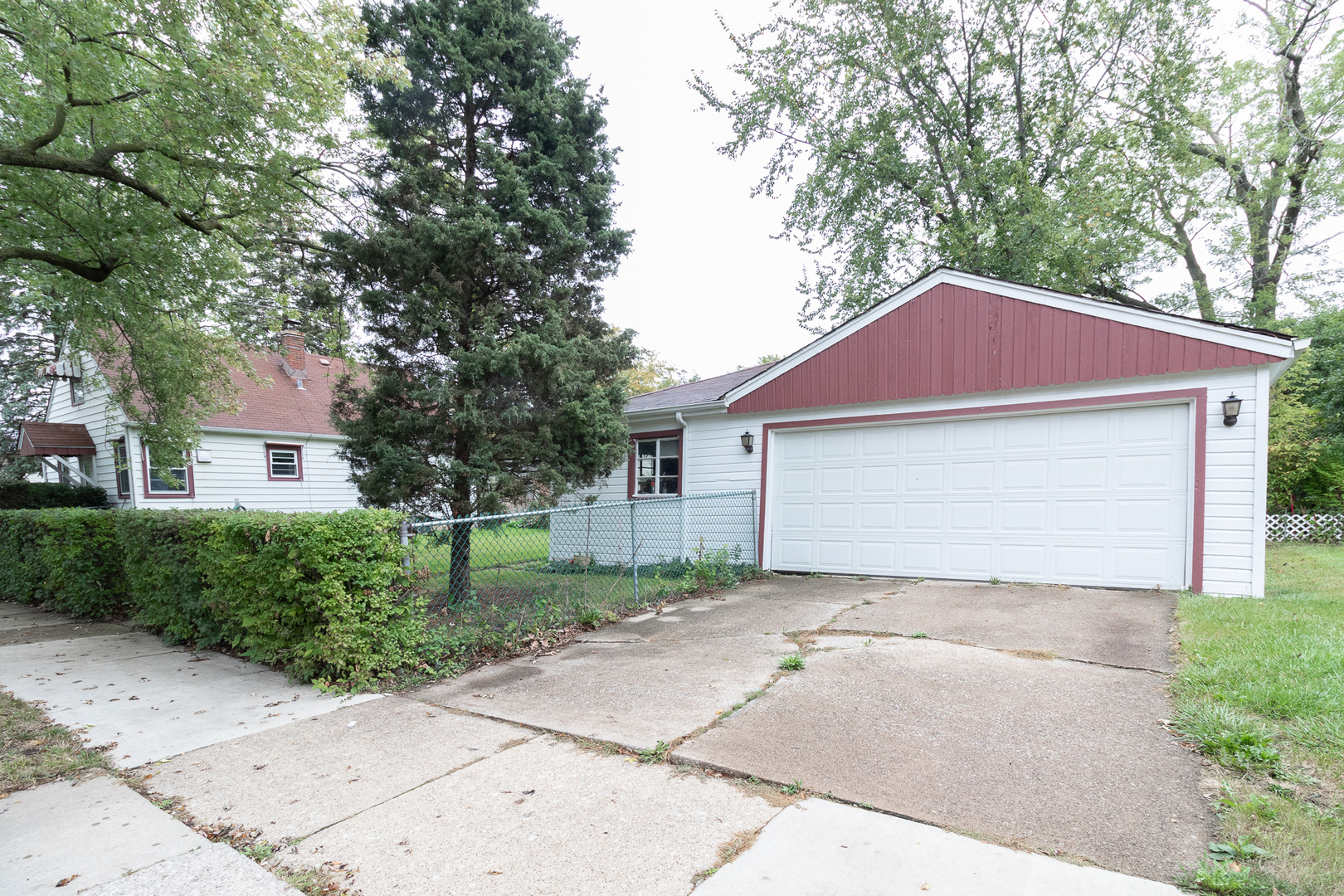 2131 Spruce Road Homewood, IL 60430 - Photo 3 of 14 a house that has a tree in front of it