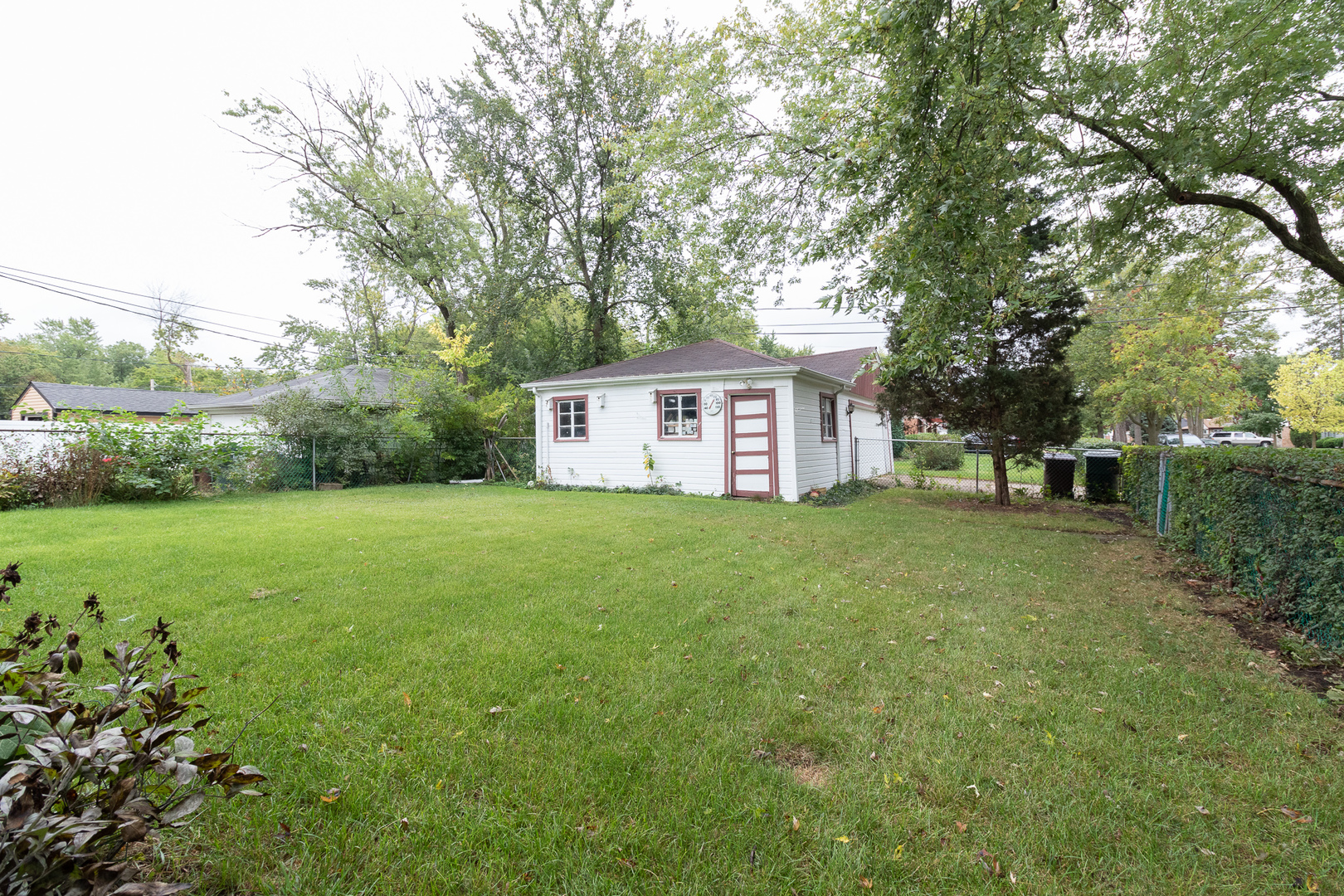 2131 Spruce Road Homewood, IL 60430 - Photo 4 of 14 a front view of a house with garden