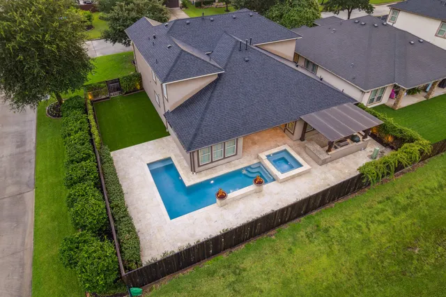 an aerial view of a house with a garden