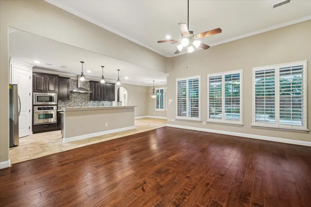 a view of a kitchen with a sink cabinets and outdoor space