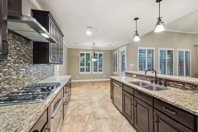 a kitchen with a sink stove and microwave
