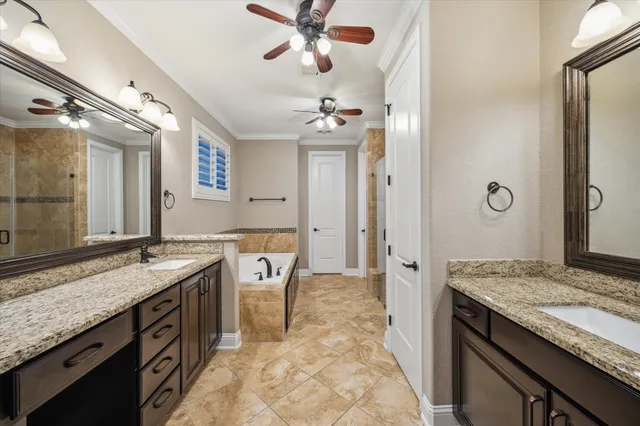 a spacious bathroom with a granite countertop sink and a mirror