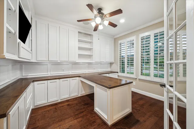 a kitchen with a stove a sink and a microwave